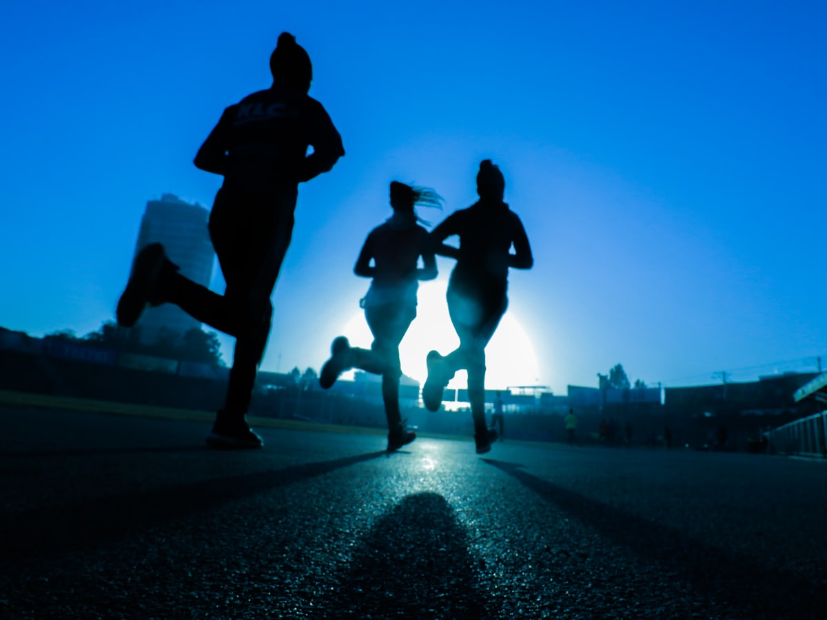 Testers running at dusk